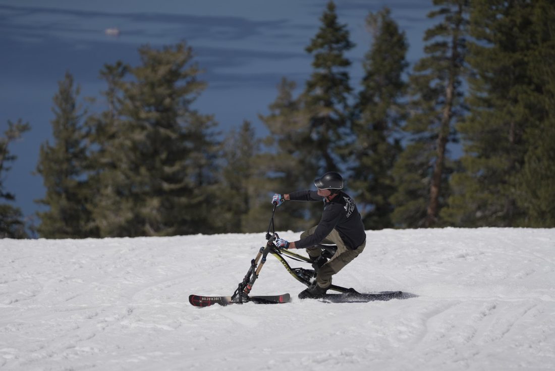 A rider cruising a groomer above Lake Tahoe